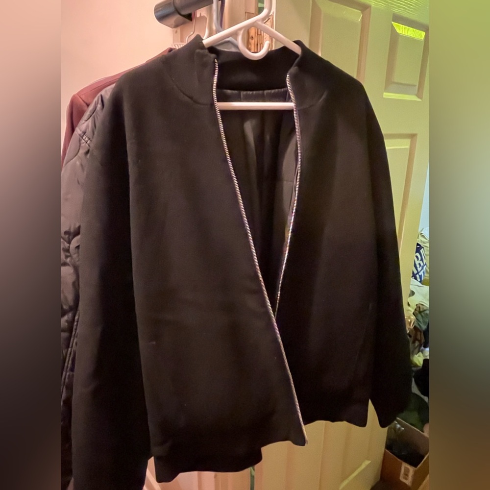 Large nice black reservable jacket/ Nordstrom’s. Holds heat well, shiny zipper